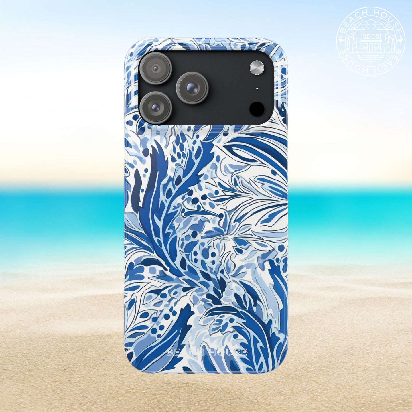 Nags Head Slim Case for iPhone 17 Pro Max with blue and white floral pattern on a beach background