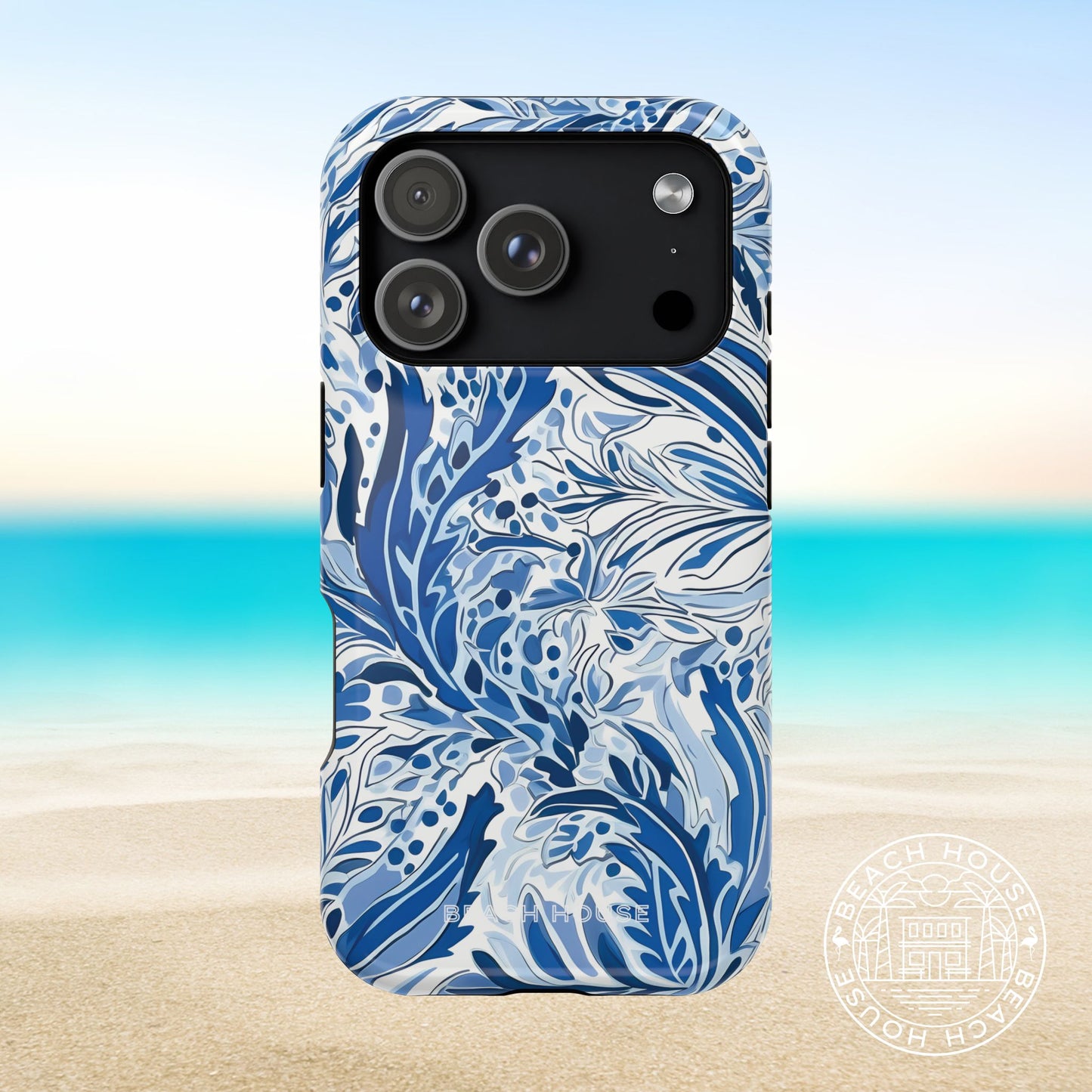 Nags Head MagSafe Tough Case for iPhone 17 Pro with blue and white floral pattern on a beach background