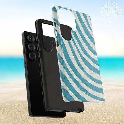 Outer shell and shock absorbent liner layers of the Holmes Beach Tough Case for Galaxy on a beach background