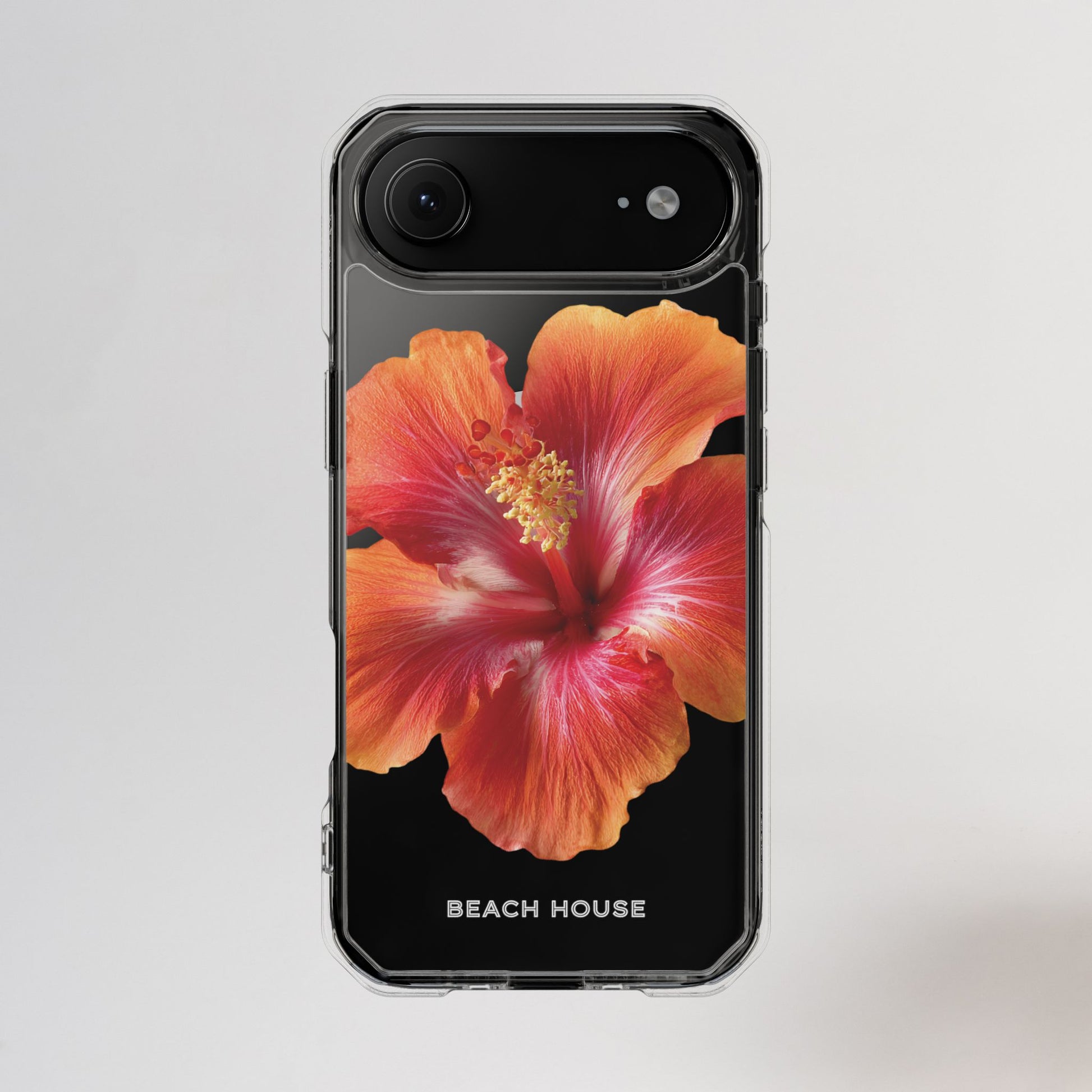 Phone case with a red flower design and 'Beach House' text on a light gray background