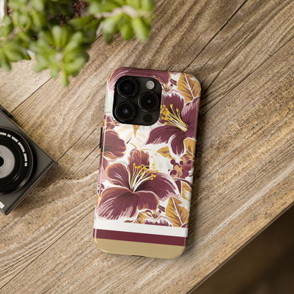 Tallahassee Tough Case for iPhone with floral design on a wooden surface next to a camera and plant
