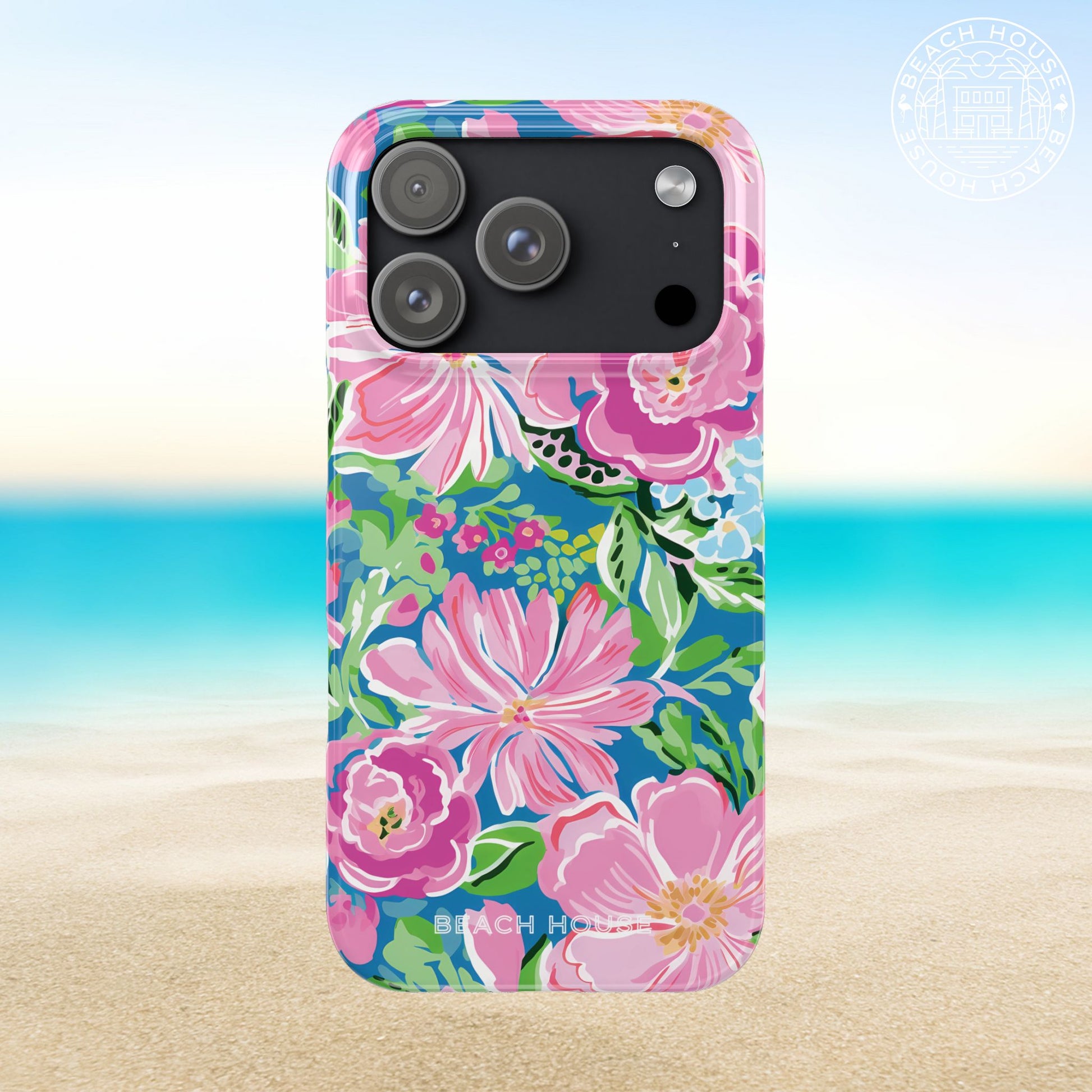 Madeira Slim Case for iPhone 17 Pro with floral design on a beach background