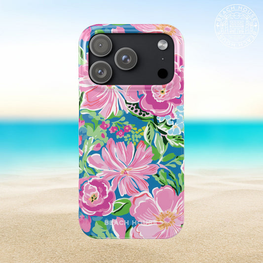Madeira Slim Case for iPhone 17 Pro with floral design on a beach background