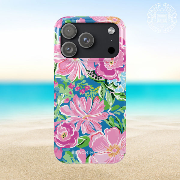 Madeira Slim Case for iPhone 17 Pro with floral design on a beach background