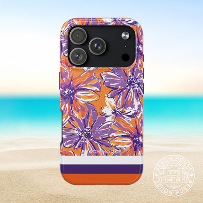 Clemson Tough Case for iPhone 17 pro with purple and orange floral design on a beach background