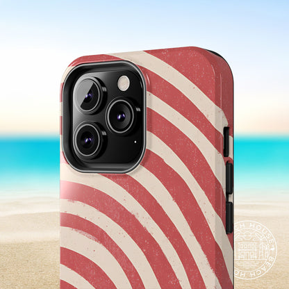 Close up view of the Kure Beach Tough Case for iPhone with red and beige wavy pattern on a beach background
