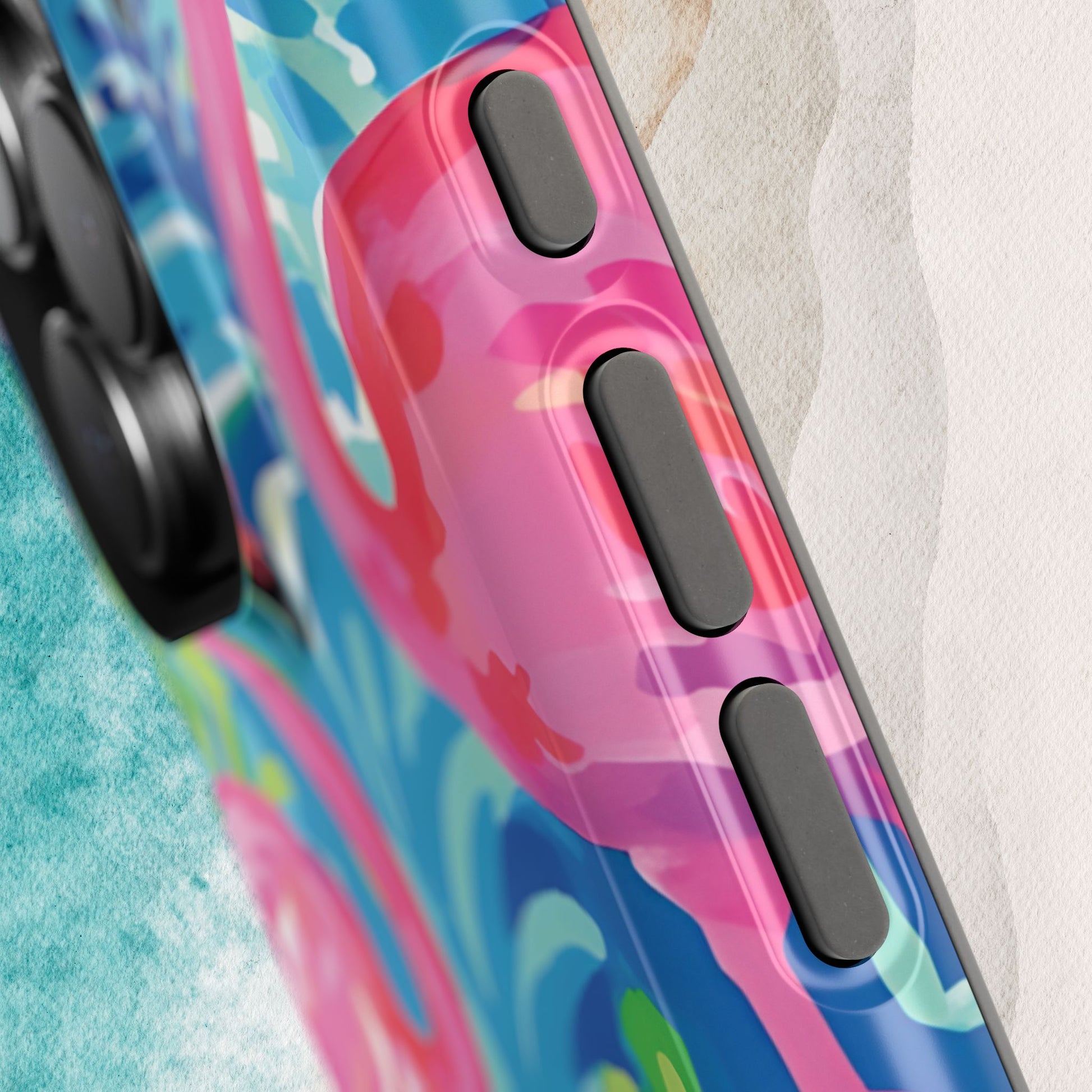 Close up view of Key Largo MagSafe Tough Case for iPhone with abstract design on a textured surface