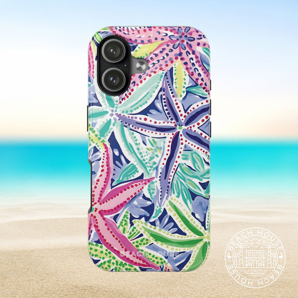Siesta Key Tough Case for iPhone 17 with colorful starfish pattern on a beach background
