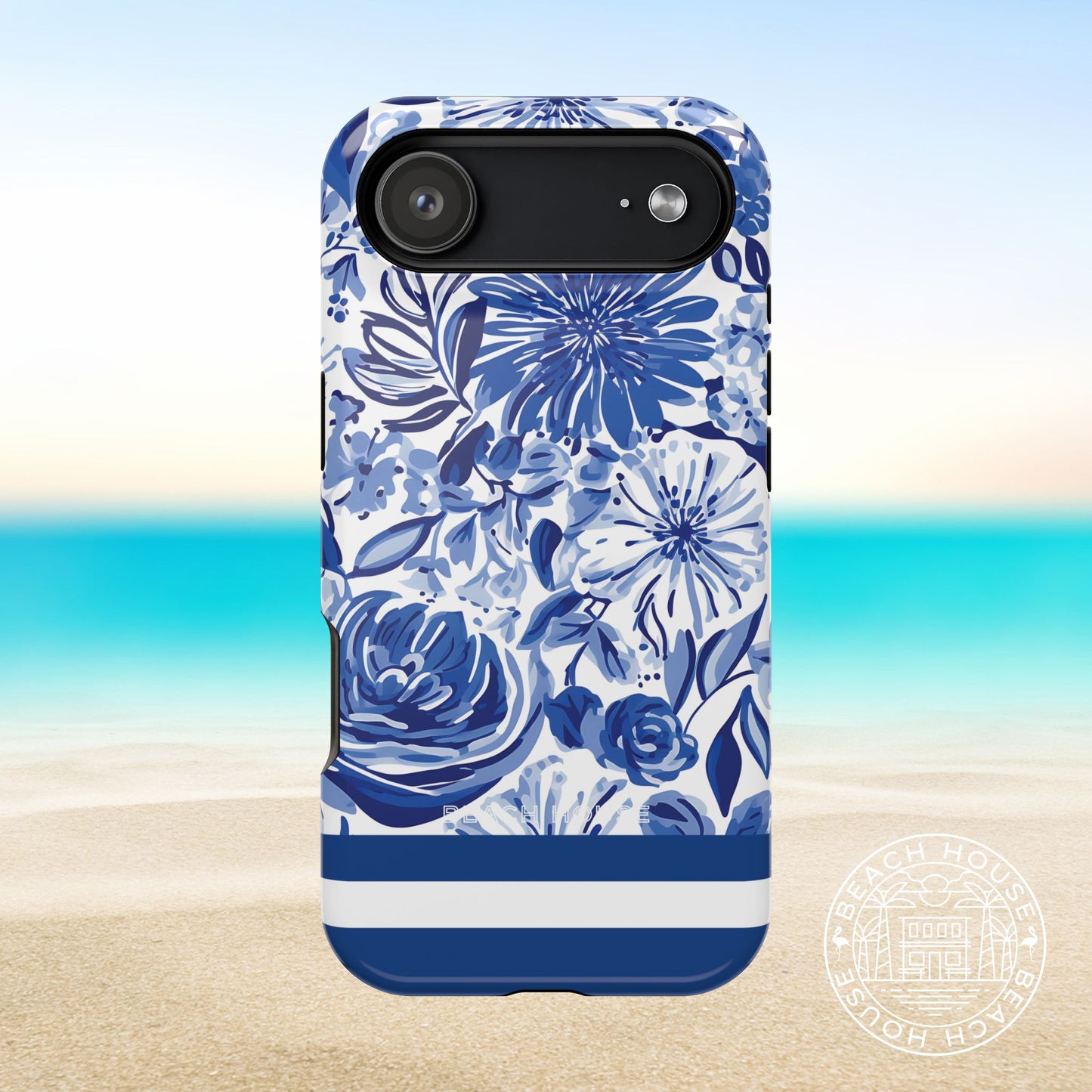 Lexington MagSafe Tough Case for iPhone 17 Air with blue floral pattern on a beach background