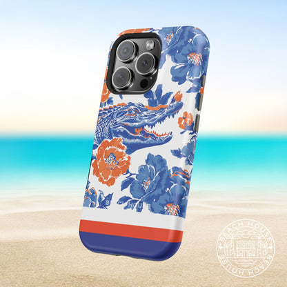 Gainesville MagSafe Tough Case for iPhone with orange and blue alligator design on a beach background