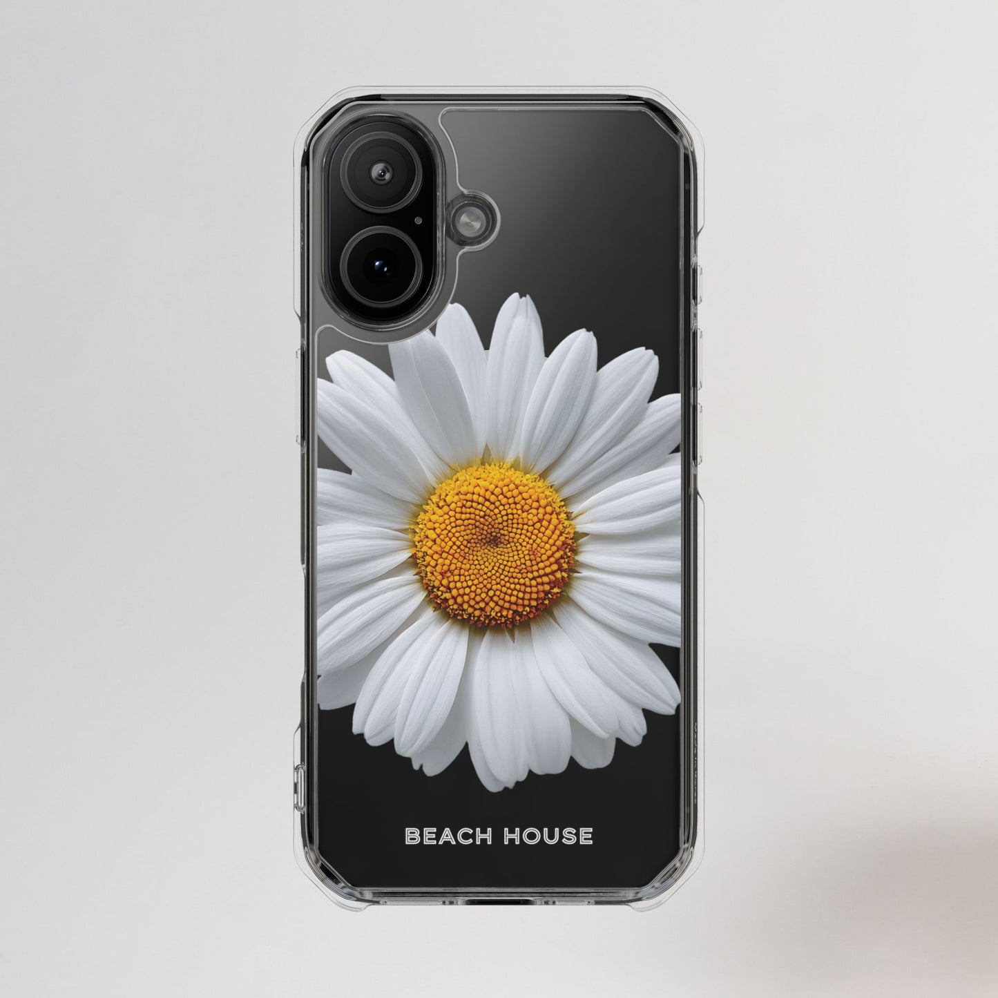 Phone case with a white flower design on a black background