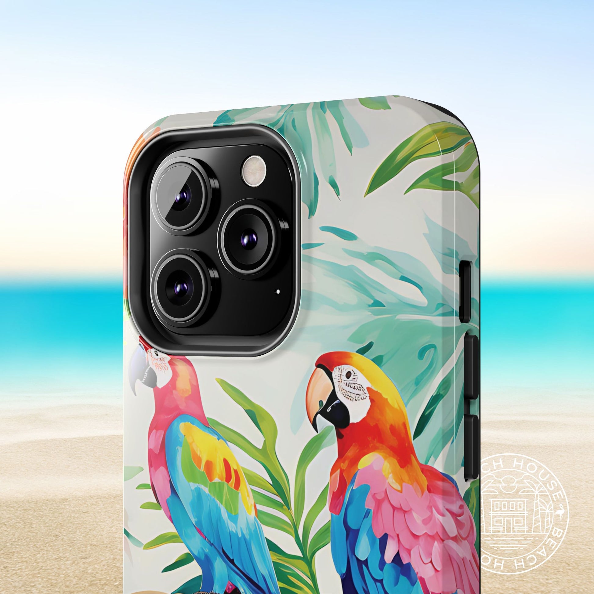 Close up view of the Copacabana Tough Case for iPhone with parrot design on a beach background