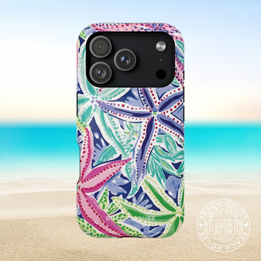 Siesta Key MagSafe Tough Case for iPhone 17 Pro with colorful starfish pattern on a beach background