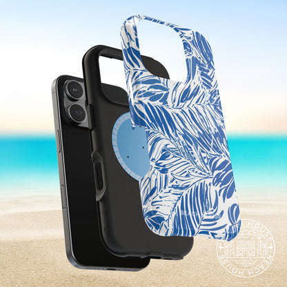Outer shell and impact resistant magnetic layers of the Hampton MagSafe Tough Case for iPhone with blue and white palm leaf pattern on a beach background