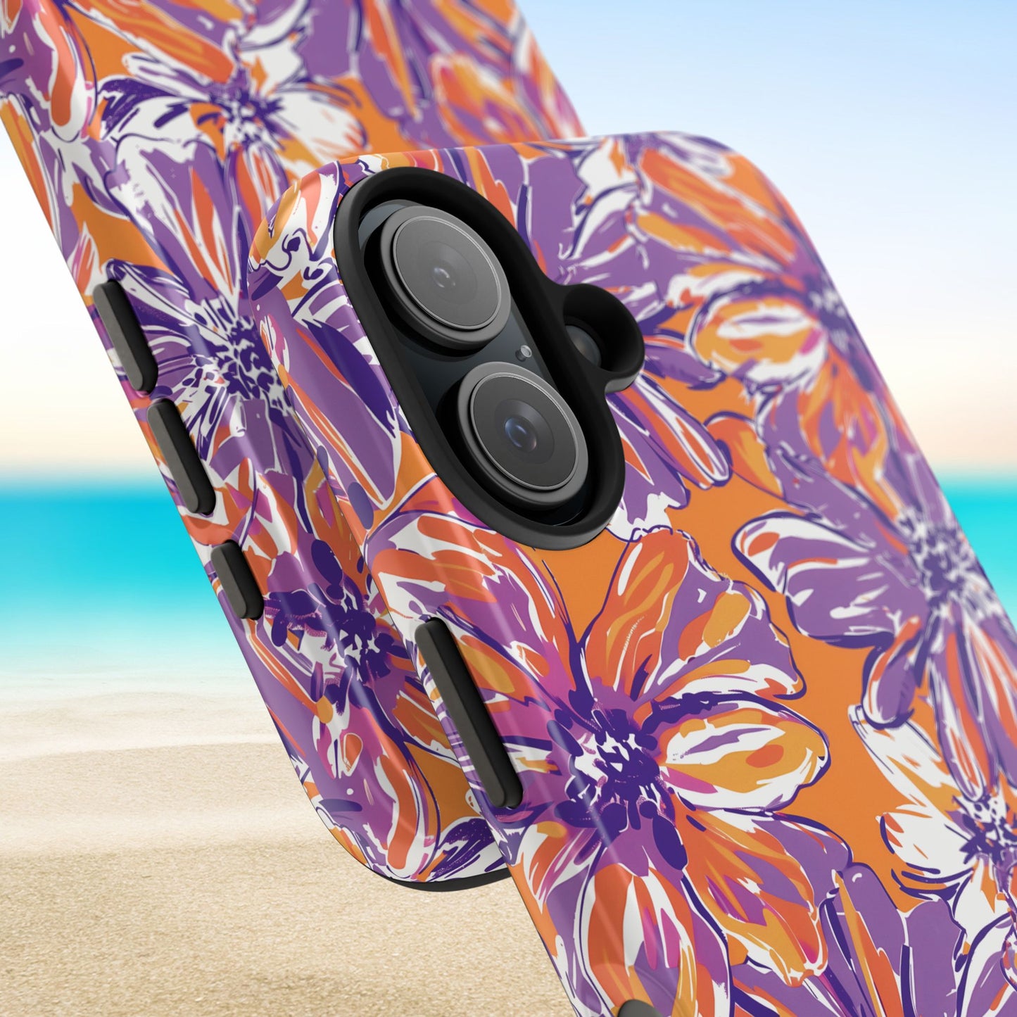 Close up views of the Clemson Tough Case for iPhone with purple and orange floral pattern on a beach background