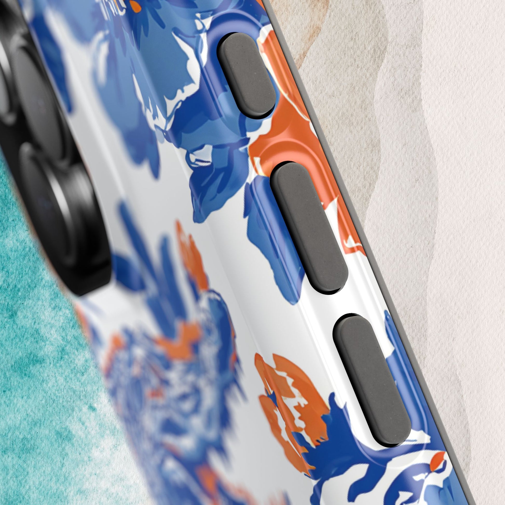 Gainesville MagSafe Tough Case for iPhone with blue and orange floral pattern on a textured surface