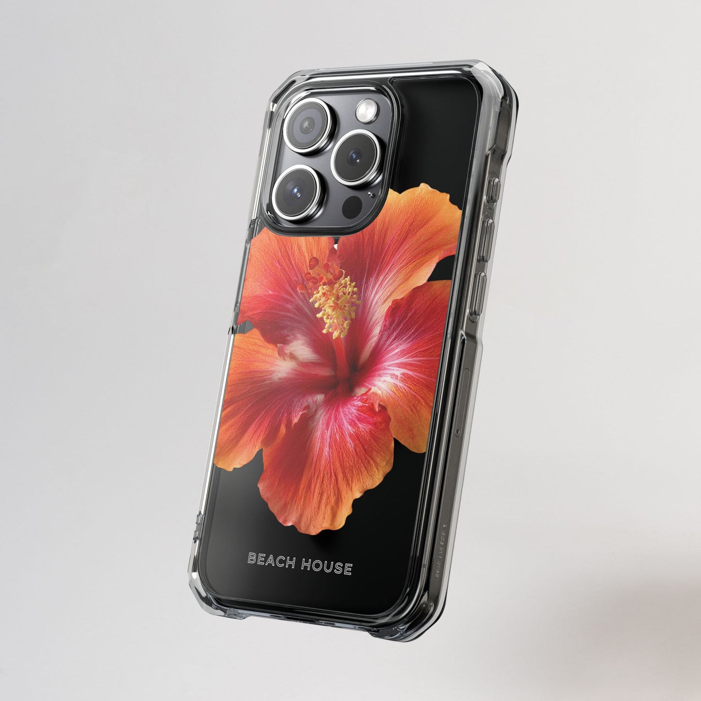 Phone case with a red flower design on a gray background