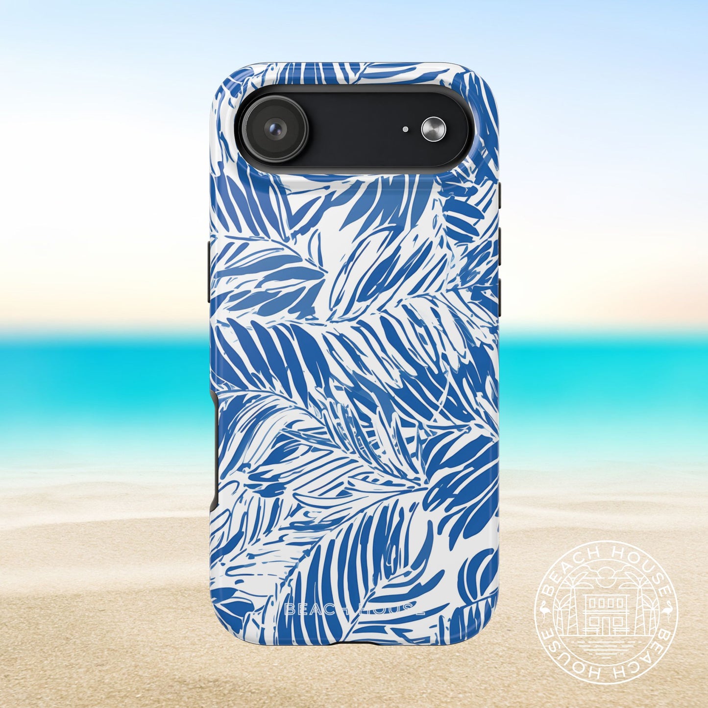 Hampton Tough Case for iPhone 17 Air with vibrant palm leaf design on a beach background