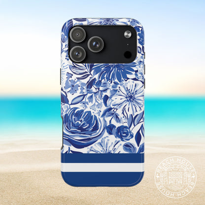 Lexington Tough Case for iPhone 17 Pro Max with blue floral design and blue and white stripes on a beach background