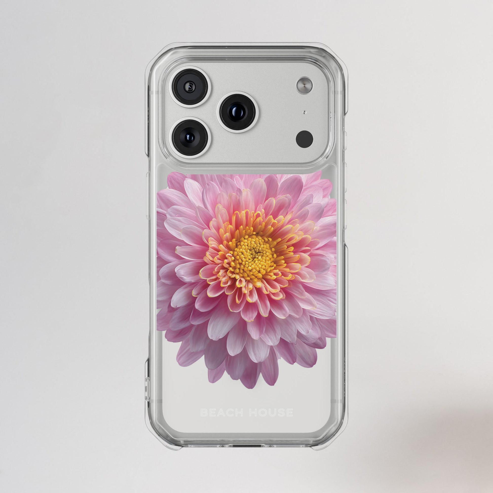 Phone case with a pink flower design on a light gray background