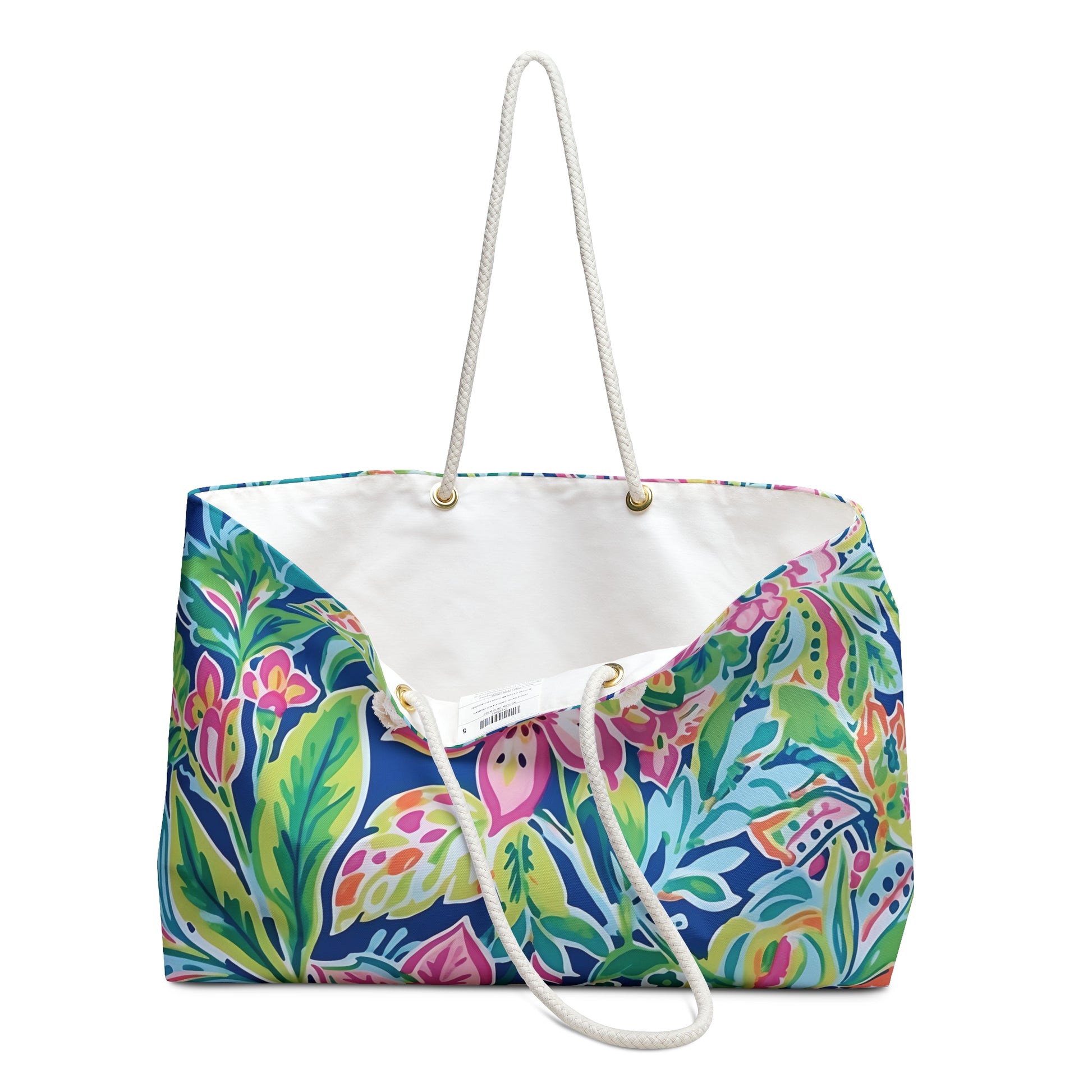 Vibrant floral-patterned tote bag with white rope handles on a white background