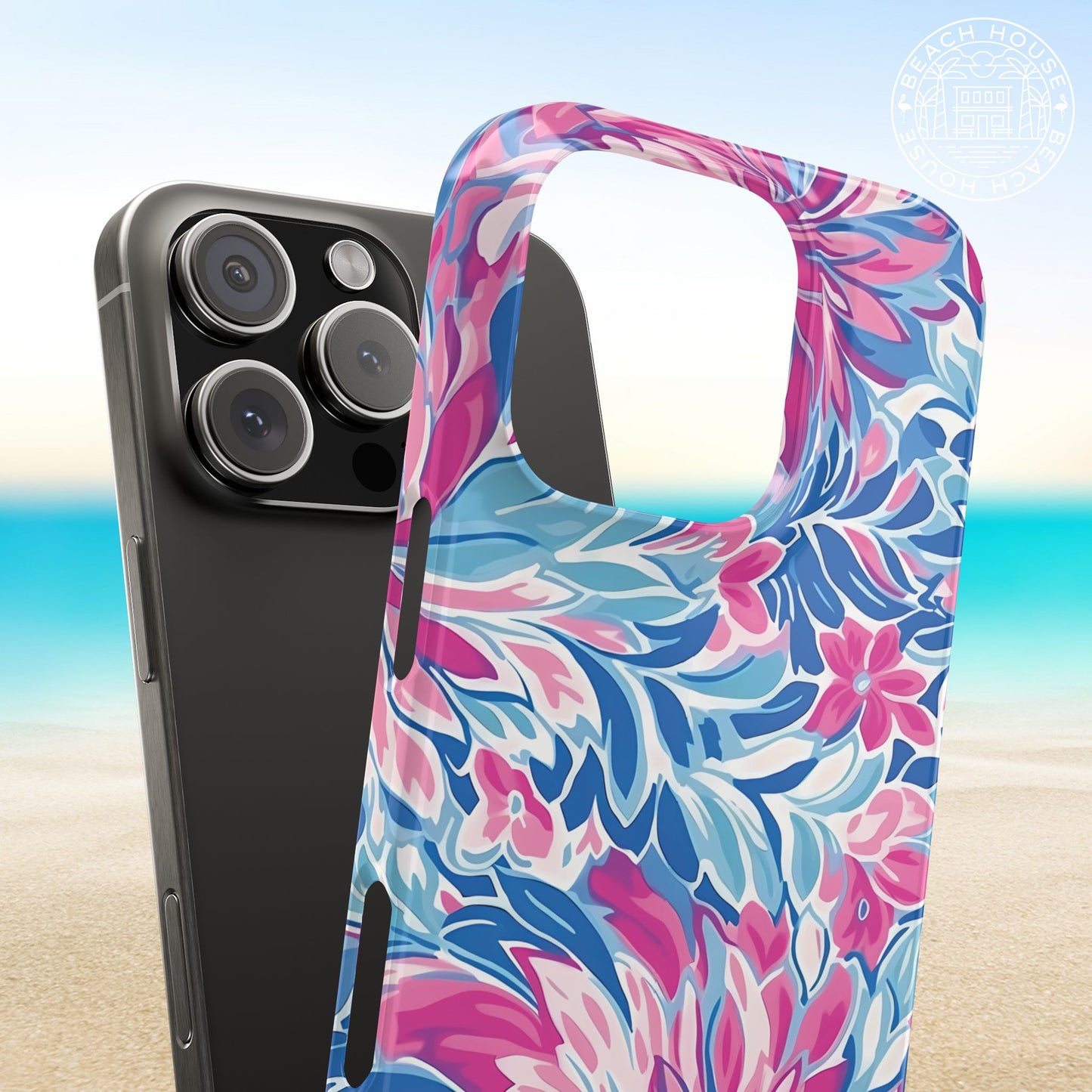Destin Slim Case for iPhone with pink and blue floral pattern on a beach background