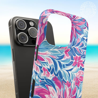 Destin Slim Case for iPhone with pink and blue floral pattern on a beach background