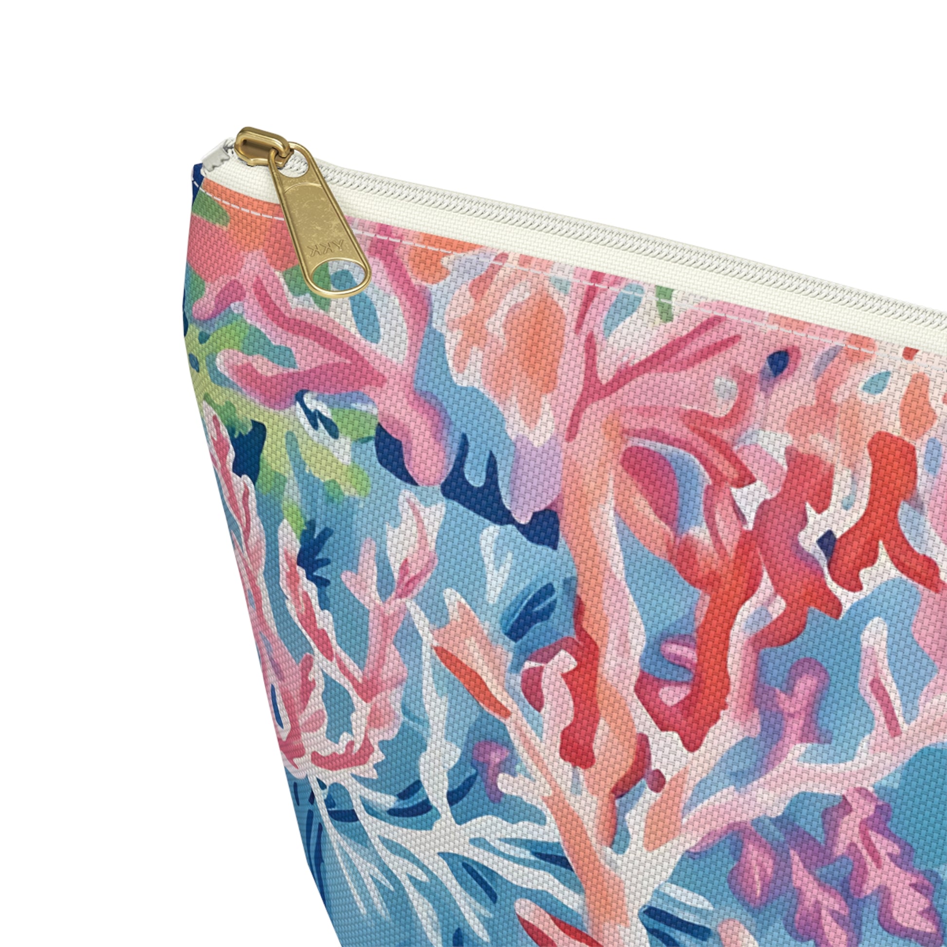 Colorful coral-patterned pouch with a gold zipper on a white background