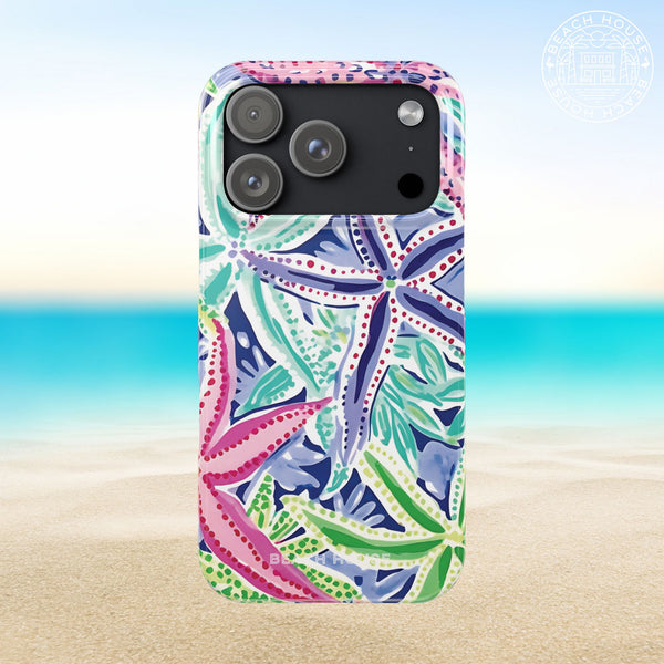 Siesta Key Slim Case for iPhone 17 Pro with colorful starfish pattern on a beach background