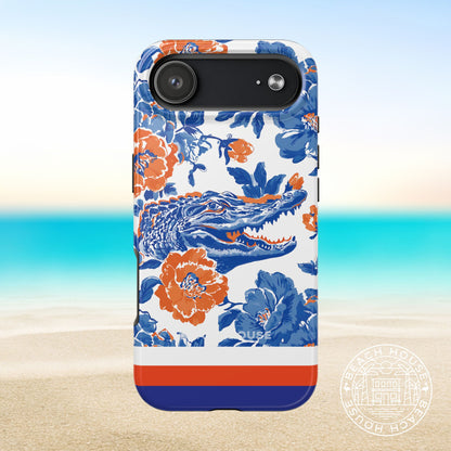 Gainesville Tough Case for iPhone 17 Air with orange and blue alligator design on a beach background