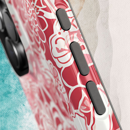 Side button detail on the Norman MagSafe Tough Case for iPhone on a textured surface