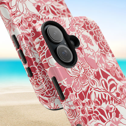 Close up views of the Norman Tough Case for iPhone with red floral pattern on a beach background