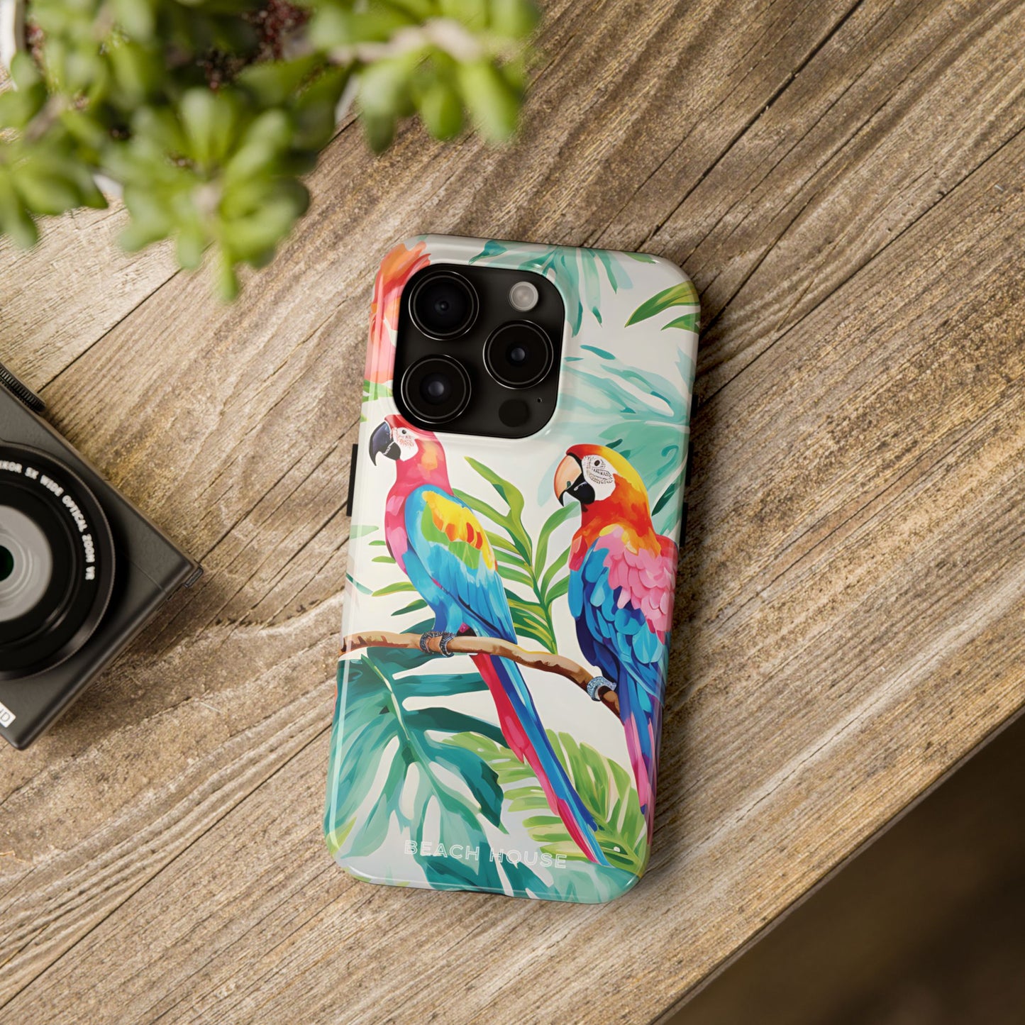 Copacabana Tough Case for iPhone with parrot design on a wooden surface