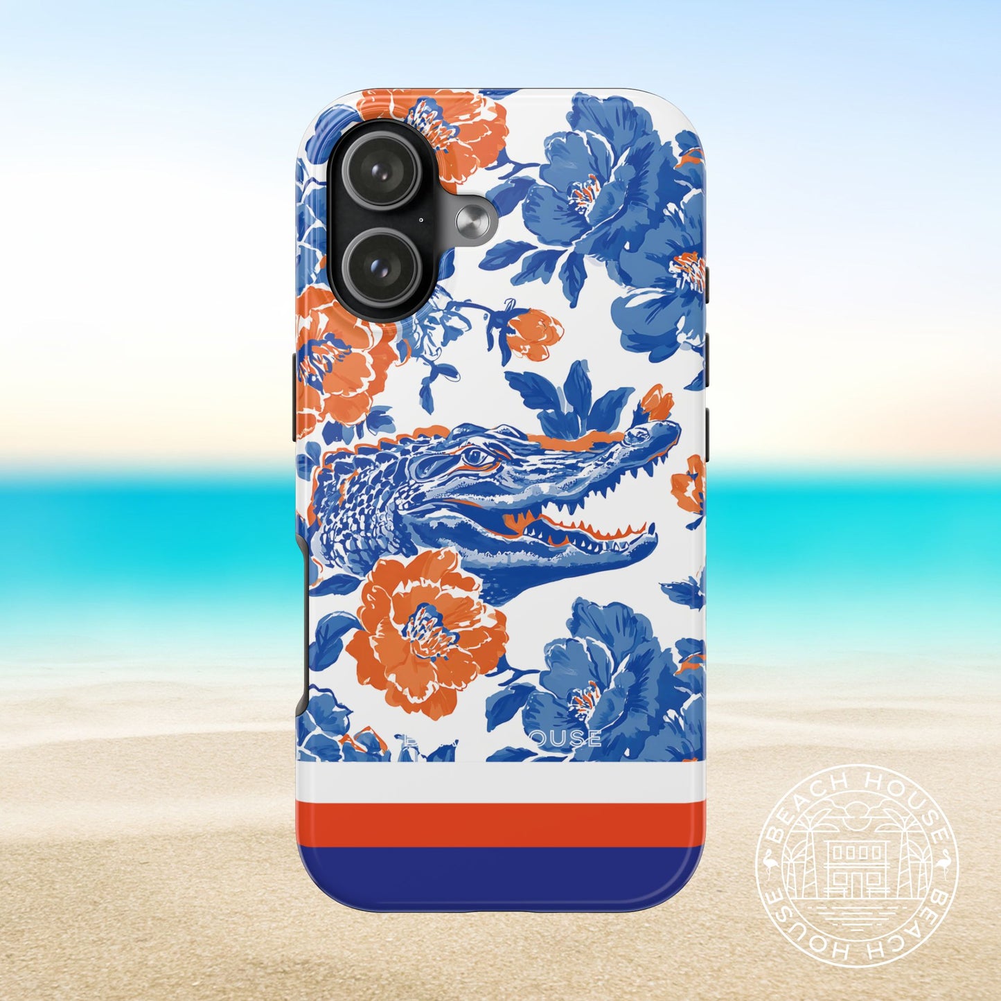 Gainesville Tough Case for iPhone 17 with floral and alligator design on a beach background