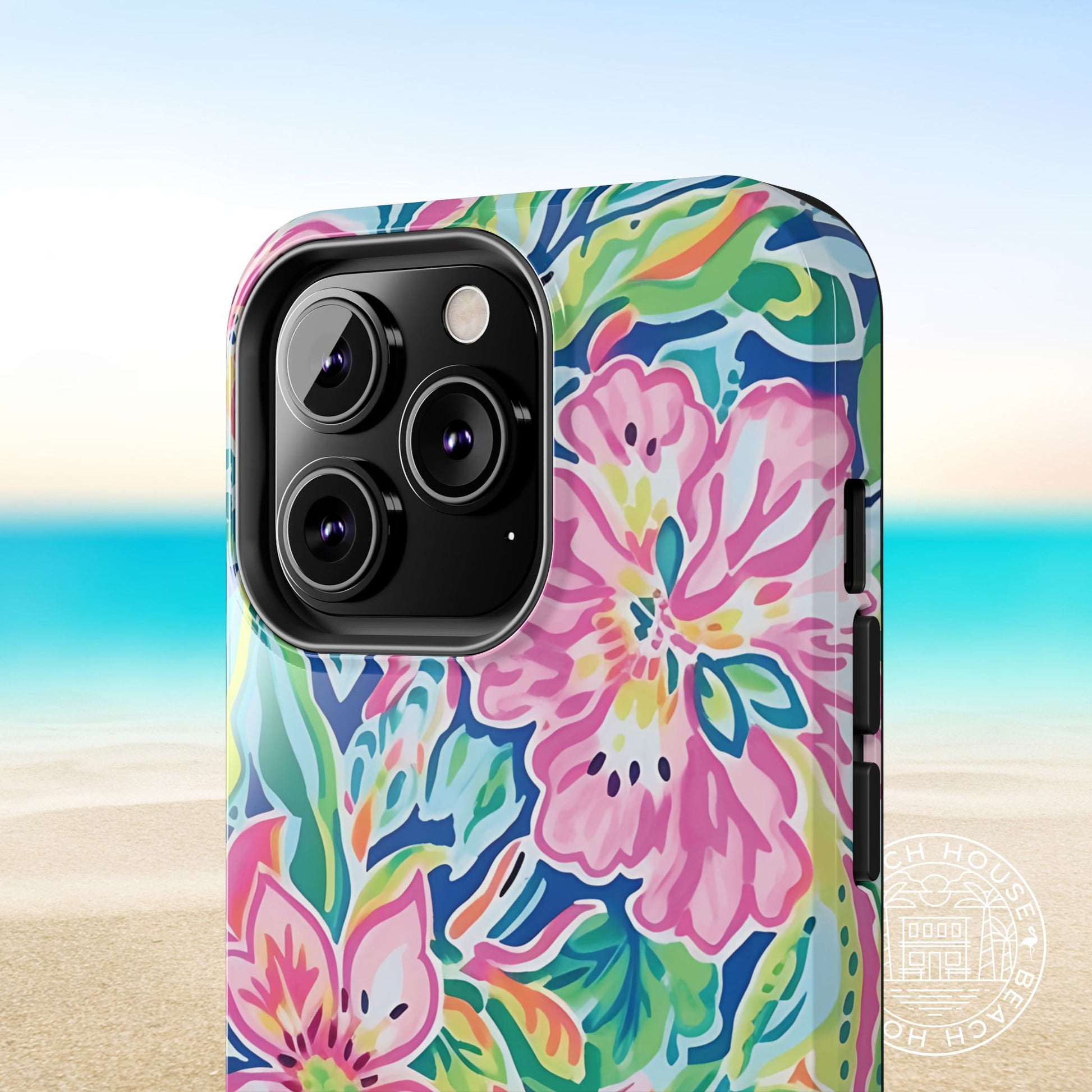 Close up view of the Fernandina Tough Case for iPhone phone case with a beach background