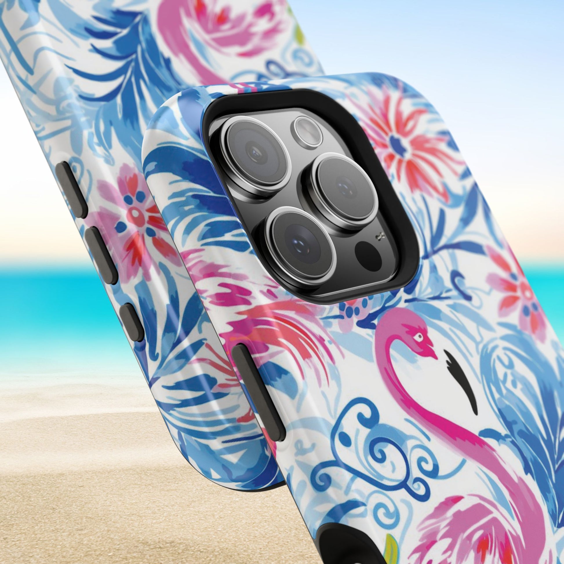 Close up views of the Flamingo Beach MagSafe Tough Case for iPhone, on a beach background