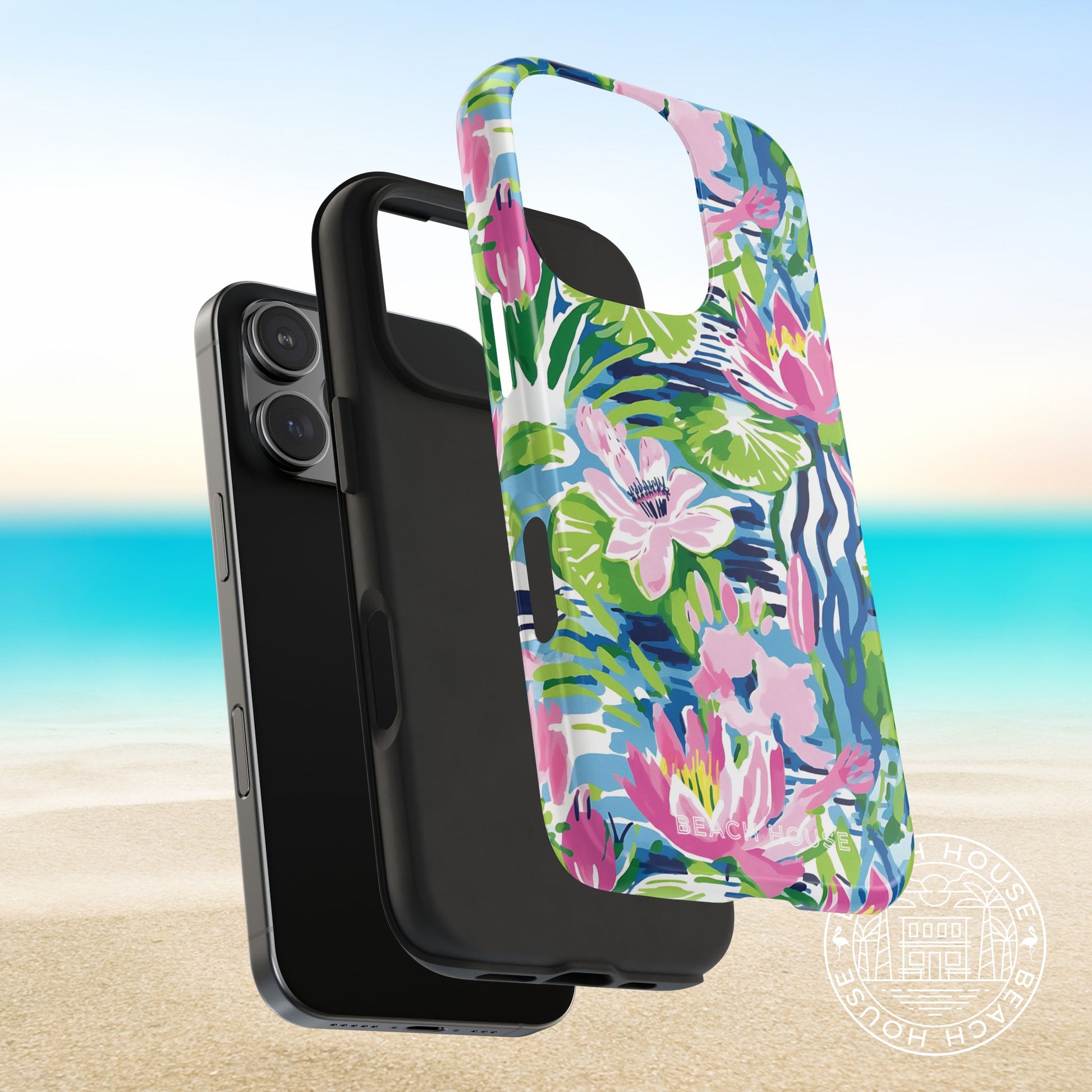 Layers of the tropical floral Everglades Tough Case for iPhone on a smartphone with a beach background