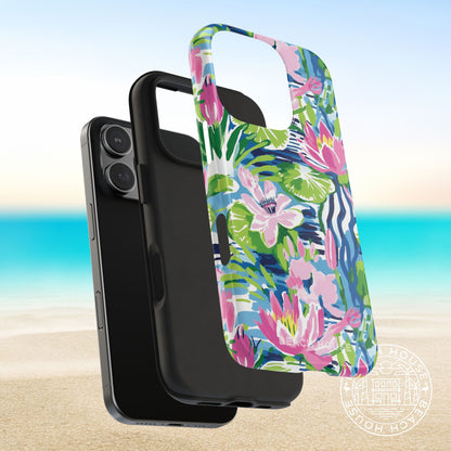 Layers of the tropical floral Everglades Tough Case for iPhone on a smartphone with a beach background