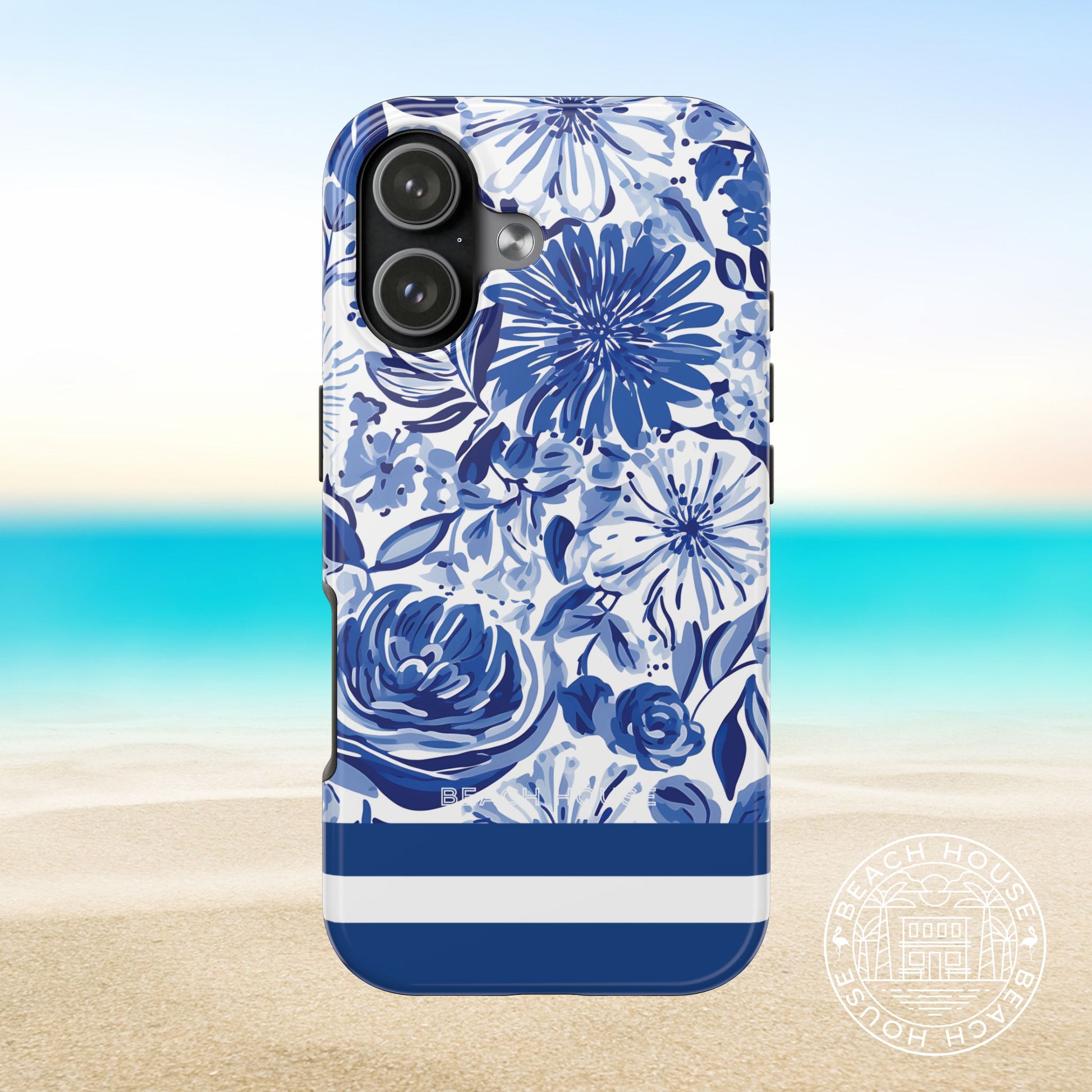 Lexington Tough Case for iPhone 17 with blue floral design on a beach background