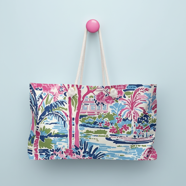 Tropical Amelia Weekender tote bag with a rope handles on a light blue background