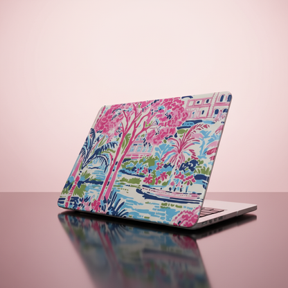 Laptop with a Amelia MacBook Case on a pink background