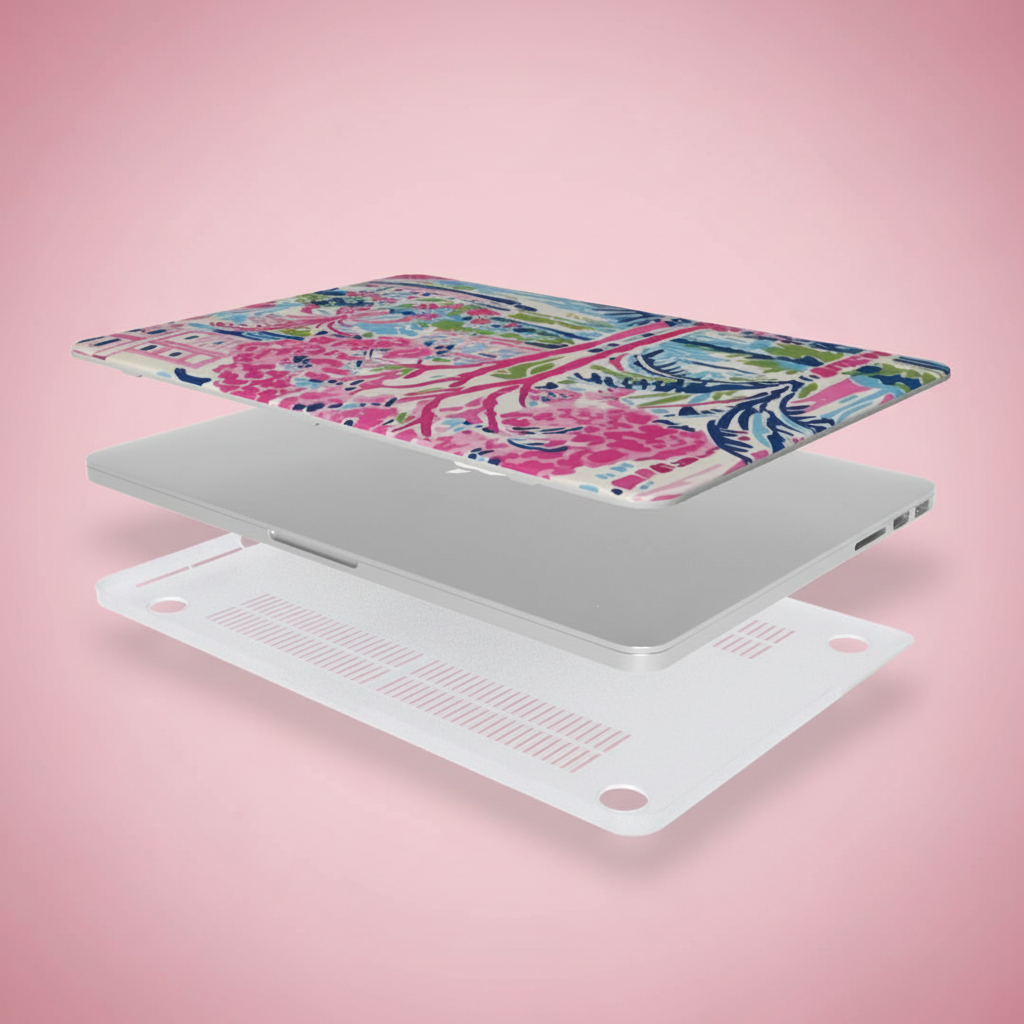 Top and bottom layers of the Amelia MacBook Case, with a laptop, on a pink background