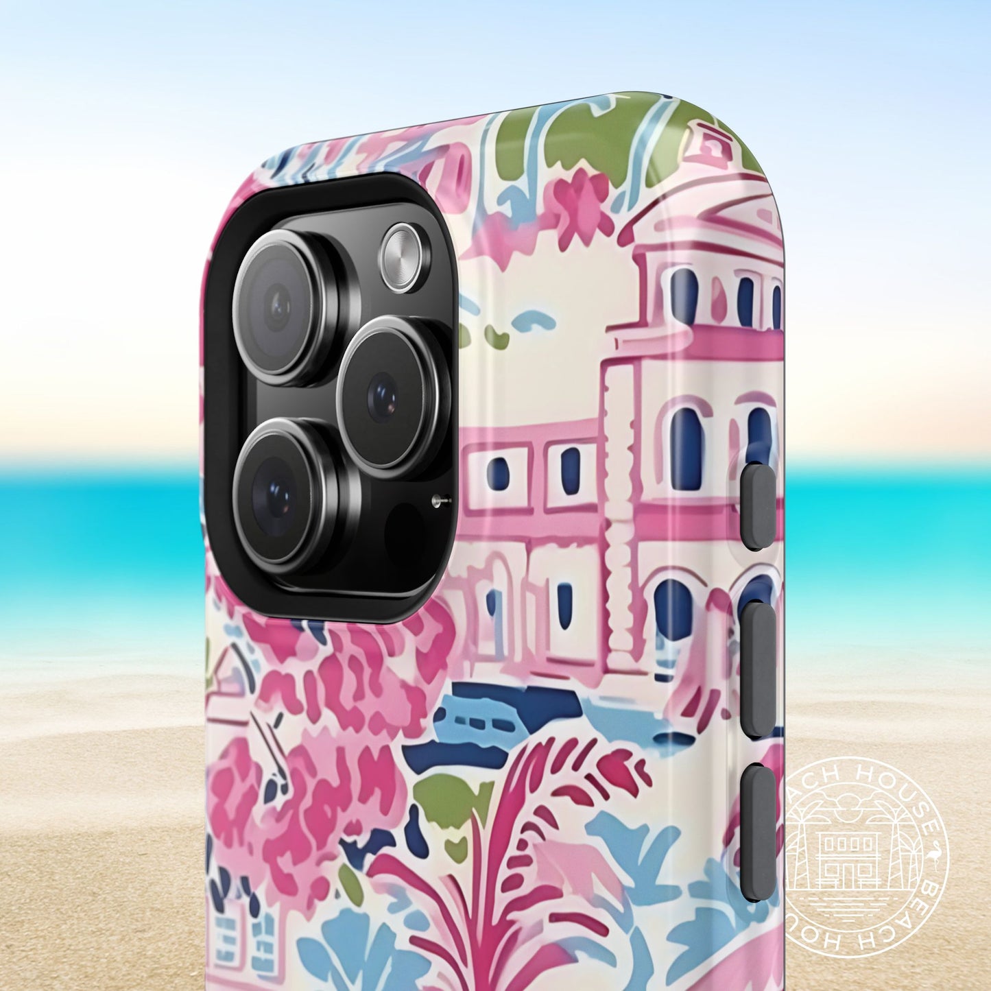 Amelia MagSafe Tough Case for iPhone with colorful design featuring buildings and floral elements on a beach background