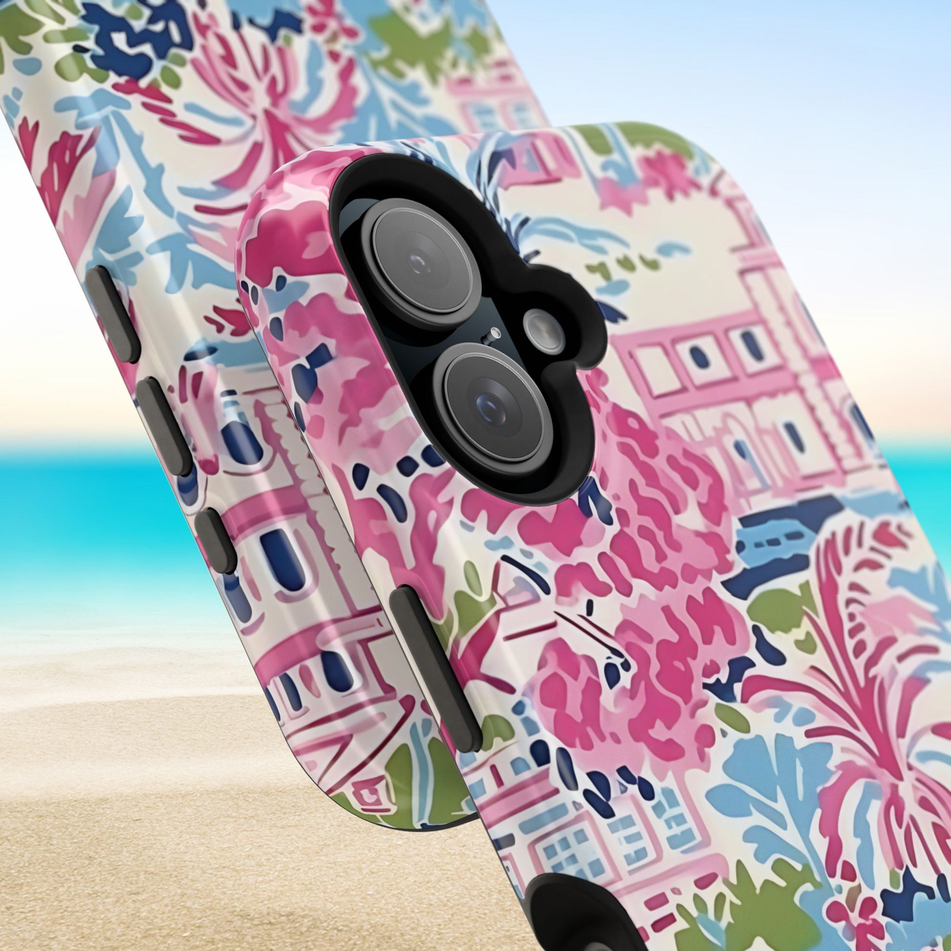 Close up views of the Amelia MagSafe Tough Case for iPhone with colorful pattern on a beach background