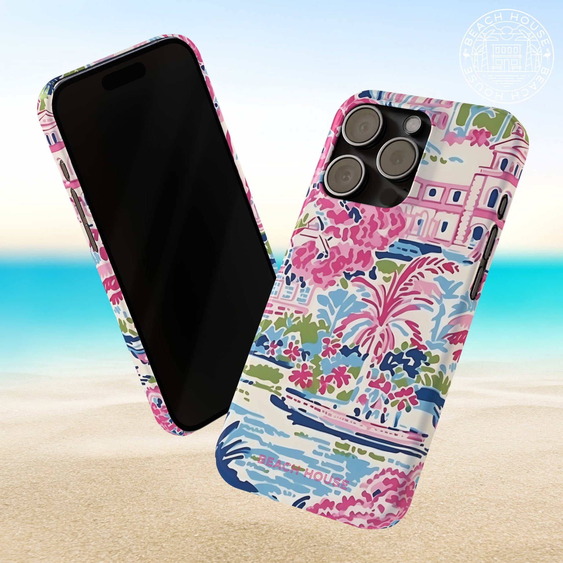 Front and back views of the Amelia Slim Case for iPhone with floral and beach house design on a beach background