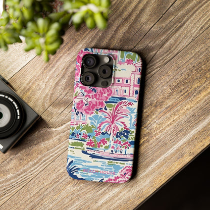 Amelia Slim Case for iPhone with colorful design on a wooden surface next to a camera