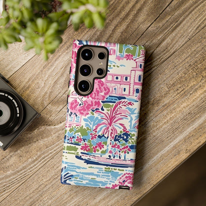 Colorful floral Amelia Tough Case for Galaxy on a wooden surface with a camera and plant in the background