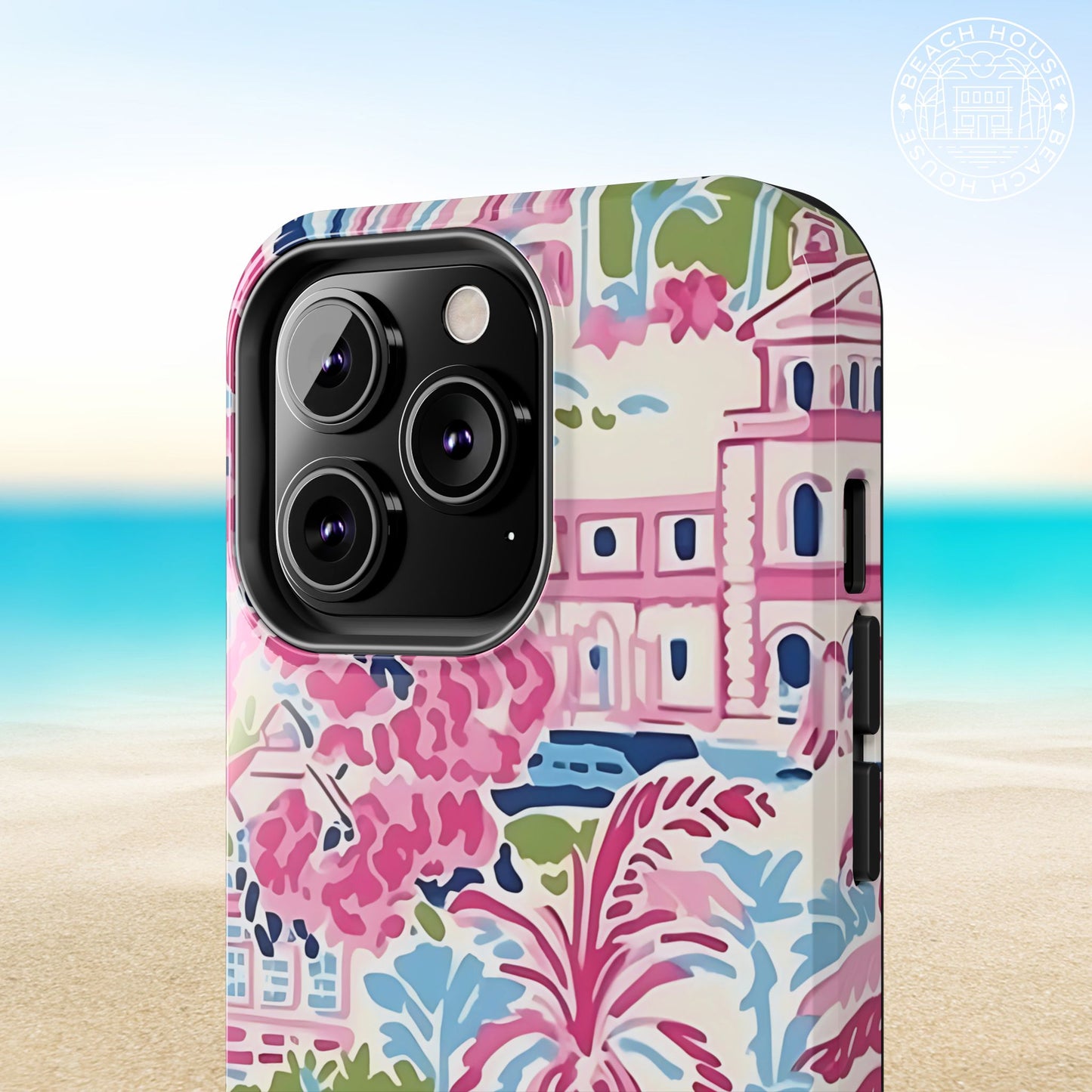 Amelia Tough Case for iPhone with colorful design featuring buildings and floral elements on a beach background