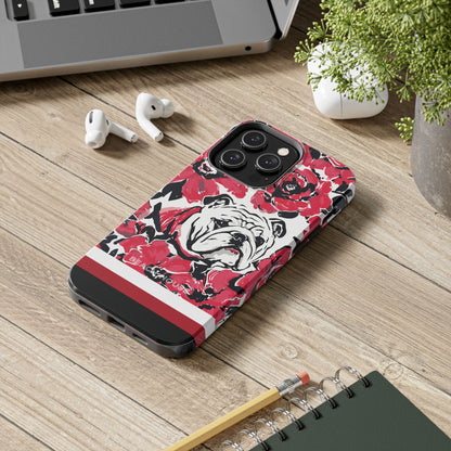 Athens Tough Case for iPhone with bulldog design on a wooden surface with laptop, earbuds, and notebook.