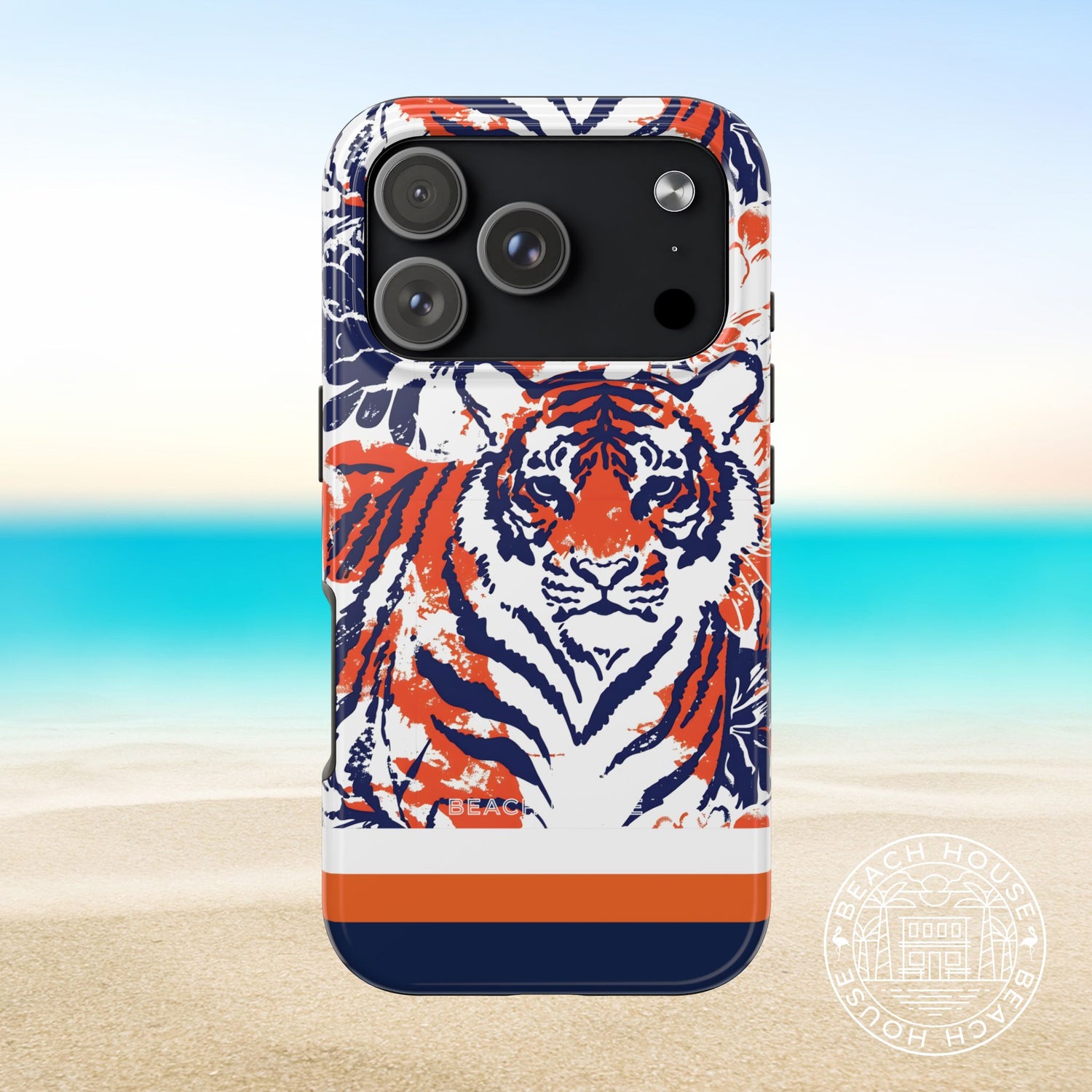 Auburn Tough Case for iPhone 17 Pro with tiger design on a beach background